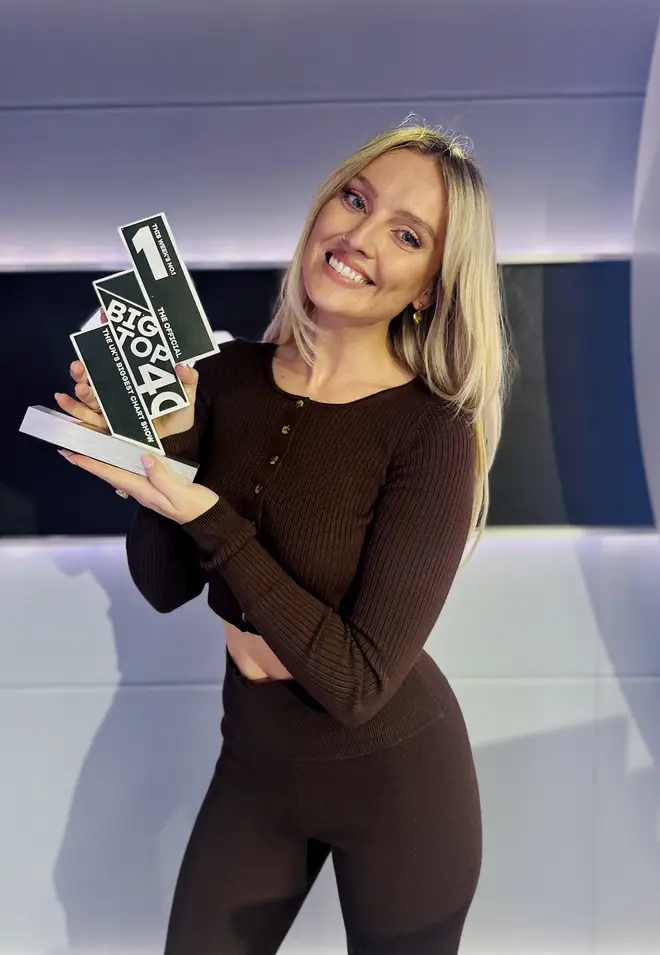 Perrie poses with the Number 1 trophy!